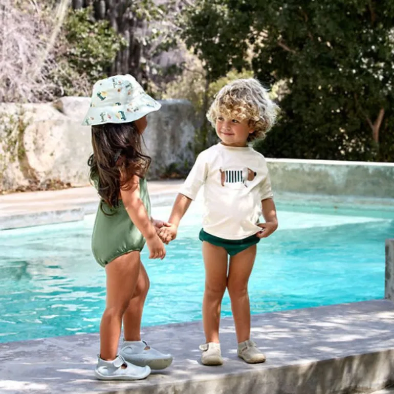 Chapeau anti-UV bébé réversible - Lassig - Camion de glace illusion bleu
