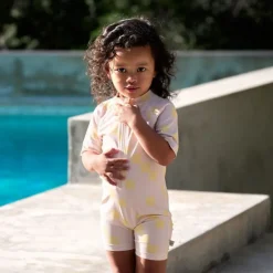 Combinaison bébé anti-UV - Lassig - Motif damier rose pâle/jaune