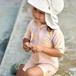 Combinaison bébé anti-UV - Lassig - Motif damier rose pâle/jaune