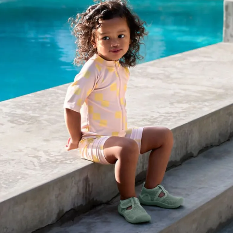 Combinaison bébé anti-UV - Lassig - Motif damier rose pâle/jaune
